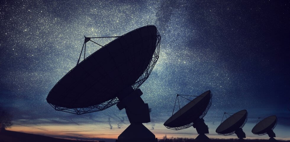 LEO Satellite dish with star trails at night