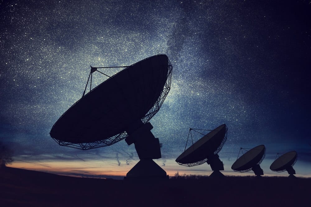 LEO Satellite dish with star trails at night