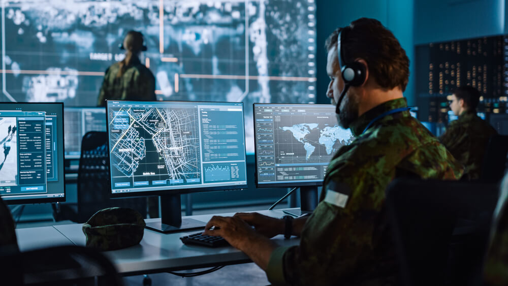 military people on computer cybersecurity